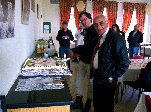André and Rolland Cutting the Cake 